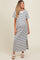 woman wearing a striped maternity maxi dress with a side slit and short sleeves, showing her baby bump