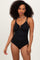 woman wearing a black ribbed one-piece swimsuit with a v-neck and adjustable straps
