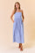 woman wearing a light blue striped maxi dress with adjustable straps and pockets