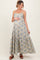 woman wearing a floral print maternity maxi dress with spaghetti straps and a baby bump visible