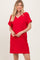 woman wearing a red short sleeve v-neck dress with a relaxed fit and a casual style