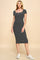 woman wearing a black and white striped midi dress with short sleeves and a square neckline