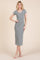 woman wearing a fitted gray short sleeve midi dress with a scoop neckline and side slits