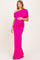 woman wearing a hot pink off-shoulder maternity gown with ruched details and holding her baby bump
