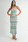 woman wearing a cream and blue zigzag patterned maxi dress with adjustable straps and chunky platform sandals