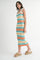 woman wearing a striped ribbed midi dress with tie straps in blue, orange, and white, paired with straw sandals