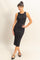 woman wearing a black fitted ribbed midi dress with a scoop neckline and styled hair