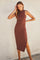 woman wearing a brown ribbed sleeveless midi dress with a side slit and high neckline