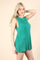 woman wearing a teal ribbed knit sleeveless dress with side cutouts
