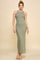 woman wearing a form-fitting olive green maxi dress with spaghetti straps and a ribbed texture
