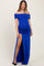woman wearing a royal blue off-the-shoulder maternity dress with side ruching and a high slit