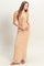 woman wearing a striped strapless maxi dress in orange and cream, holding her baby bump