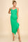 woman wearing a vibrant green midi dress with spaghetti straps and a ruffled hem