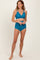 woman wearing a teal bikini top with scalloped edges and matching high-waisted bottoms