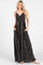 woman wearing a black and white striped maxi dress with pockets and thin adjustable straps