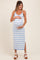 woman wearing a light blue maternity maxi dress with white stripes and holding her baby bump
