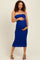 woman wearing a fitted royal blue strapless maternity dress and holding her baby bump