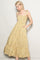 woman wearing a floral yellow maxi dress with adjustable straps and pockets
