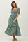 woman wearing a blue floral maxi dress with puff sleeves and a smocked bodice