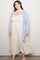 woman wearing a light blue open cardigan over a floral maxi dress in plus size