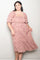 plus size woman wearing a pink floral midi dress with puff sleeves and a square neckline