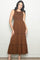 woman wearing an orange leopard print sleeveless maxi dress with a tiered skirt