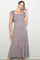 woman wearing a floral maxi dress with short ruffled sleeves and a square neckline