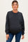 woman wearing a dark grey oversized maternity sweatshirt and showing her baby bump
