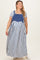 woman wearing a blue and white striped maternity plus maxi dress with overall style and a fitted bodice