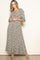 woman wearing a floral long sleeve maxi dress with a square neckline and puff sleeves