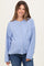 woman wearing a light blue maternity cardigan with buttons and a relaxed fit, showing her baby bump