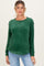 woman wearing a dark green maternity sweatshirt with long sleeves and a relaxed fit, posing with a neutral background