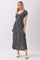 woman wearing a black floral maxi dress with short sleeves and a front slit
