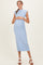 woman wearing a light blue ribbed maternity dress with cap sleeves and a baby bump