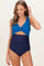 woman wearing a blue maternity swimsuit with a twisted front design and navy bottom, showing off her baby bump