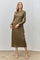woman wearing a long sleeve olive green midi dress with a fitted silhouette and a high neckline