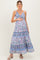 woman wearing a floral print maternity maxi dress and holding her baby bump