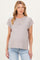 woman wearing a light gray short sleeve maternity top with rolled cuffs and a visible baby bump