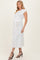 woman wearing a white maternity dress with a tie belt and short sleeves, showcasing her baby bump