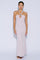 woman wearing a blush pink halter neck gown with a keyhole detail and a fitted silhouette