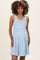 woman wearing a light blue ribbed maternity dress with a ruffled waistband and a visible baby bump
