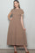 woman wearing a taupe smocked maxi dress with flutter sleeves and a tiered hemline