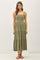 woman wearing an olive green smocked midi dress with adjustable straps and a tiered skirt