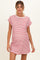 woman wearing a red and white striped maternity dress with short sleeves and a relaxed fit, showcasing her baby bump