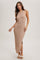 woman wearing a ribbed beige slip dress with a side slit and spaghetti straps