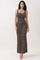woman wearing a black and tan striped maxi dress with spaghetti straps and a fitted silhouette