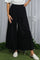 woman wearing black wide-leg trousers with an elastic waistband and flowy fabric