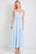 woman wearing a light blue maxi dress with lace details and adjustable spaghetti straps