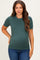 woman wearing a dark green short sleeve maternity top and showing her baby bump
