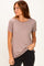 woman wearing a mauve short sleeve t-shirt with a relaxed fit and a casual look